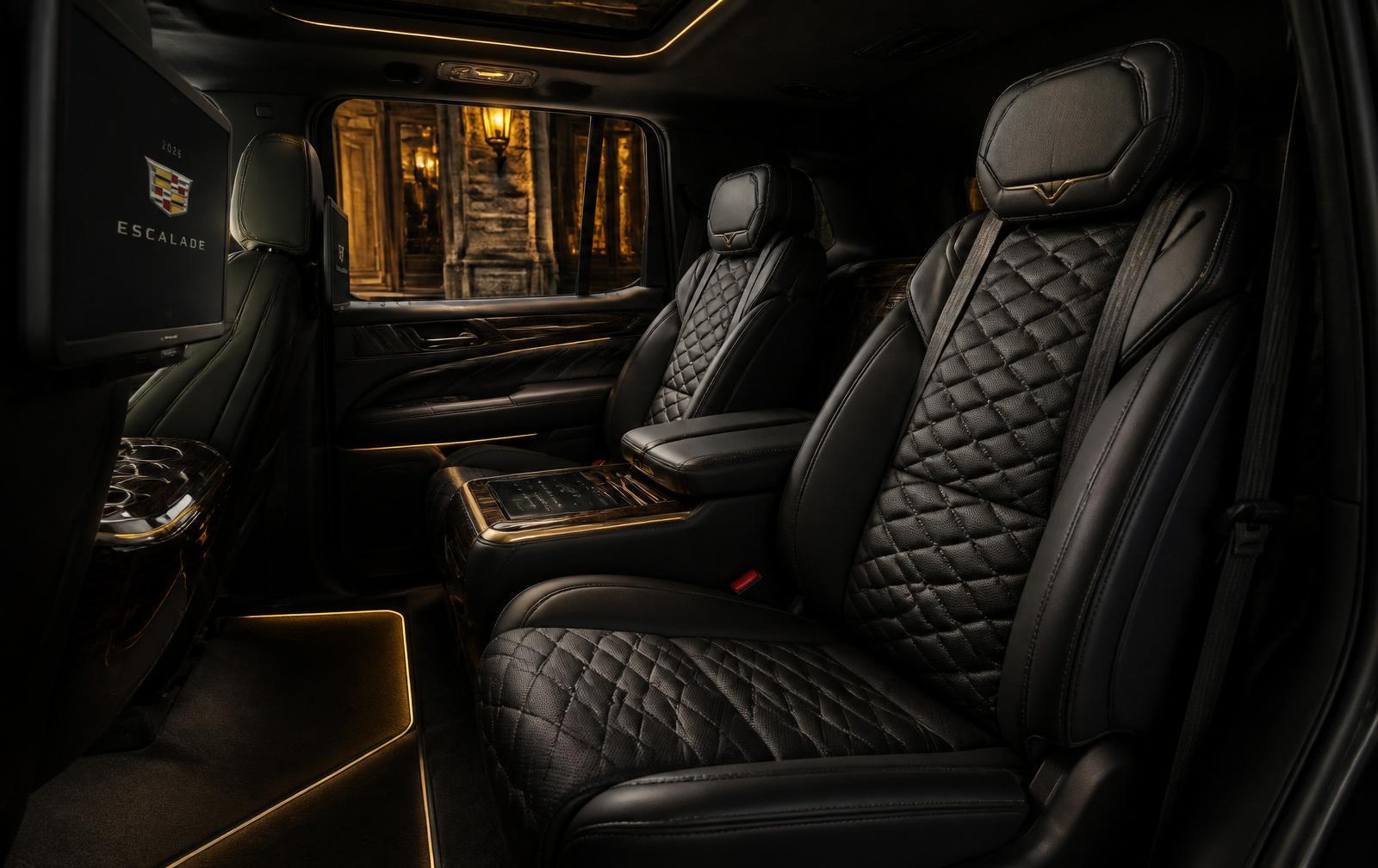 Quilted leather interior of a Cadillac Escalade with ambient gold lighting